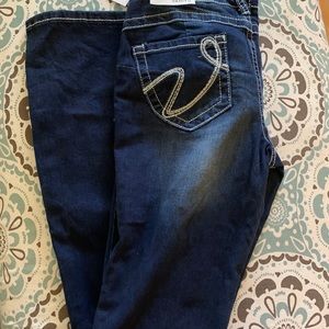 Vanity “Uplift” Boot Jeans.